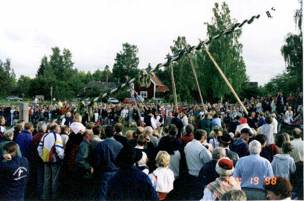 The maypole being raised